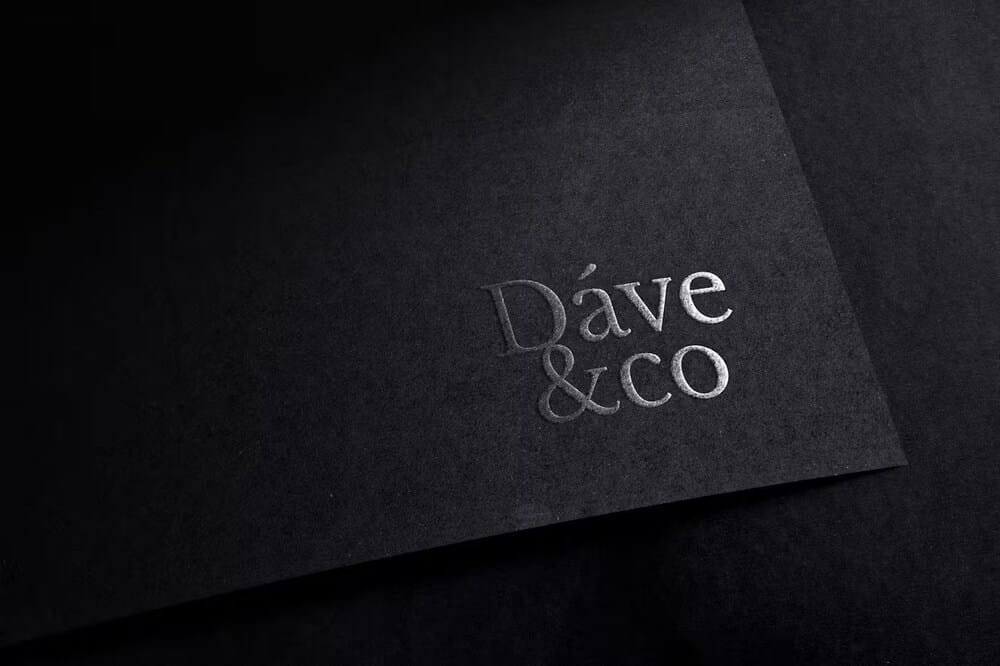Embossed logo mockup on dark paper