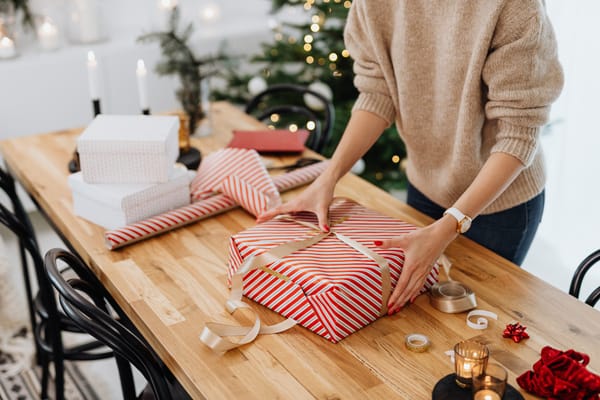 A woman creates a gift wrapping